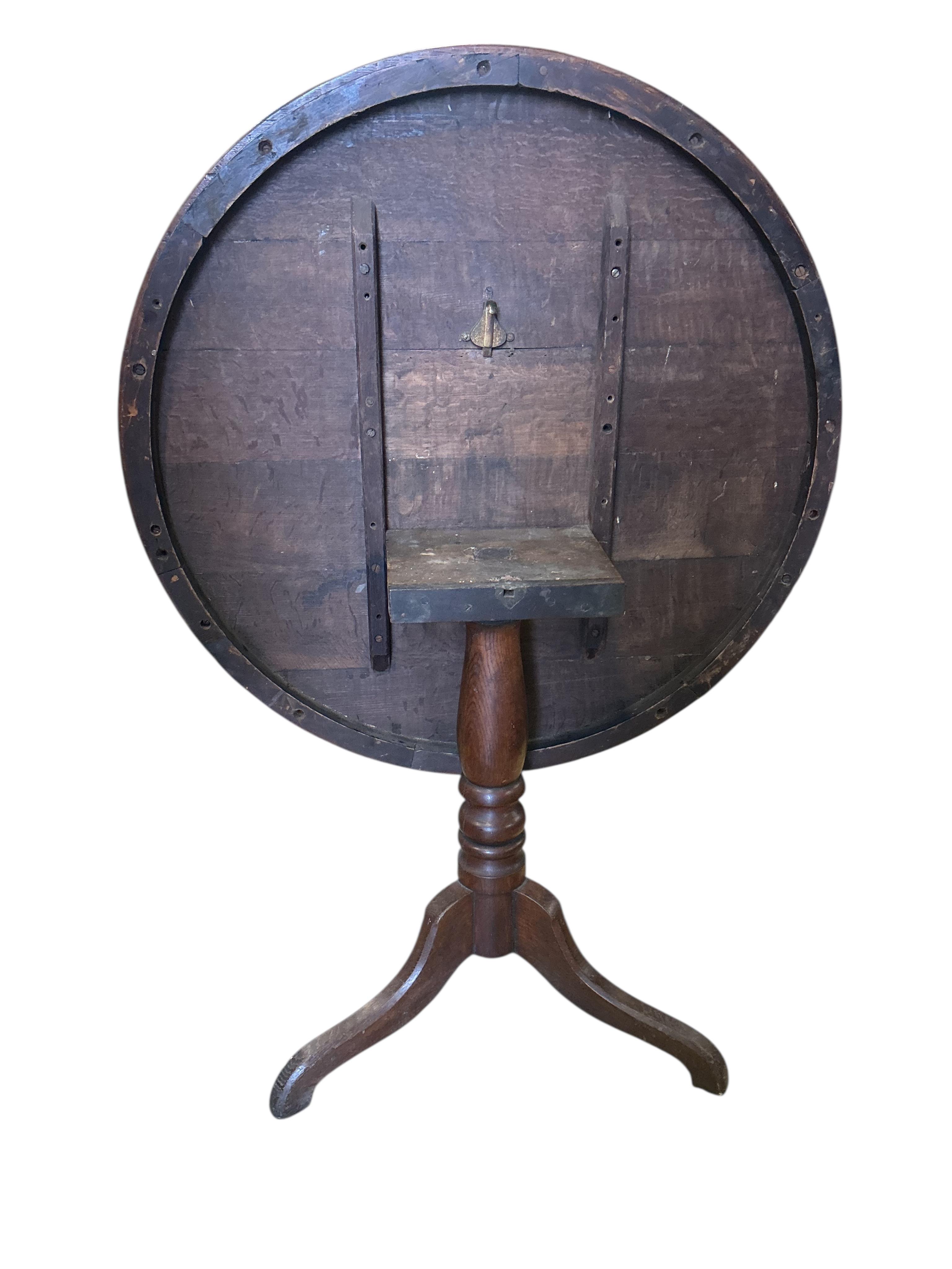 A 19th century circular oak tilt top tripod breakfast table, diameter 97cm, height 74cm